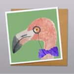 Flamingo illustration on a greeting card with a purple bow tie