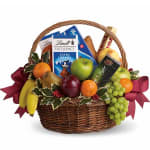 Fruit basket with chocolates and a burgundy ribbon