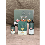 Plant care gift set with three bottles and a pouch in front of a box