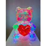 Colorful faceted teddy bear holding a red heart