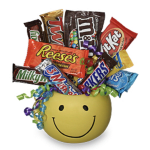 Candy bars arranged in a yellow smiley-face container