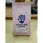 Pink bag of Joshua Tree Coffee on a counter