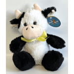Plush cow toy with a yellow ribbon and hanging tag