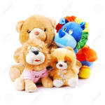Four plush teddy bears, including one with a rainbow mane
