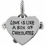 Heart-shaped charm engraved with "Love is like a box of chocolates"