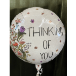Round balloon with floral print and the words "THINKING OF YOU"