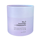 Lavender candle in a cylindrical container labeled No. 5 Lavandin + Chamomile