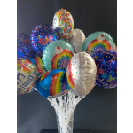 Cluster of colorful birthday balloons in a clear vase