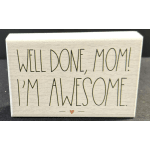 Decorative sign reading "Well done, Mom! I'm awesome."