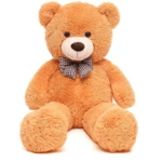 Orange teddy bear with a checkered bow tie on a white background
