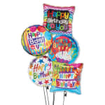 Cluster of colorful birthday balloons with printed messages