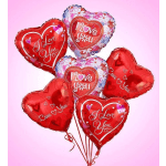Cluster of heart-shaped red and pink balloons with love messages