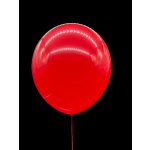Single red balloon on a black background
