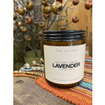 Lavender soy wax candle in an amber glass jar with a black lid