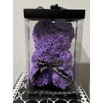 Purple rose teddy bear in a clear gift box with a black ribbon