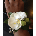 White orchid wrist corsage with silver bead accents