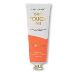 Tube of orange vanilla hand cream with a gold cap