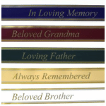 Stack of memorial ribbon banners with remembrance phrases