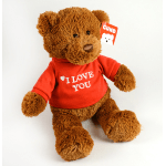 Brown teddy bear wearing a red shirt that says I LOVE YOU