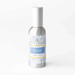 Bottle of sea salt room spray with a white cap