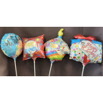 Four birthday foil balloons on sticks with colorful printed designs