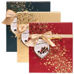 Three decorative chocolate gift boxes with ribbon bows