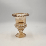 Small amber glass vase with a flared rim and pedestal base