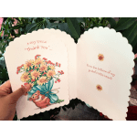 Open thank-you card with a teddy bear and bouquet illustration
