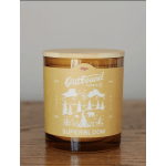 Amber candle in a glass jar with a wooden lid