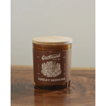 Brown candle in a glass jar with a wooden lid