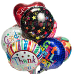 Cluster of colorful foil balloons with messages like Congratulations and Thank You