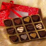 Box of heart-shaped chocolates in a red gift box