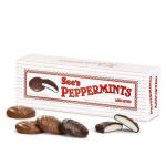 Box of See's Peppermints with several chocolate candies in front