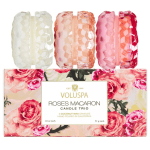 Three rose-scented candles in faceted glass jars with a floral gift box