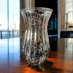 Decorative silver glass vase on a wooden table