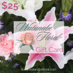Floral-themed gift card over pink lilies, pink carnations, and small purple flowers