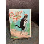 Greeting card with a cat riding a bicycle and the words "Clever Cats"