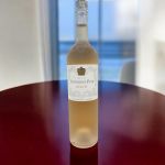 A bottle of Notorious Pink Grenache on a table