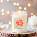 Scented candle in a glass jar with a "Best Sister Ever" label