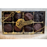Box of assorted chocolates with a gold ribbon