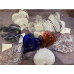 Assorted glass heart-shaped ornaments in white, blue, red, and patterned finishes