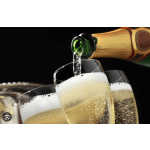 Champagne being poured into flutes against a dark background