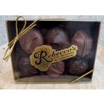 Box of assorted chocolate truffles with a gold ribbon