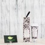Honey almond hand cream tube and matching box with a florist card