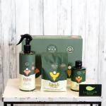 Plant care gift set with spray bottle, pouch, and bottle on a table