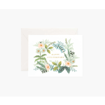 Anniversary card with a floral wreath design on a white envelope