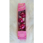 Pink Lindt Lindor truffle box with three wrapped chocolates