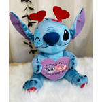 Blue plush character holding a purple heart sign