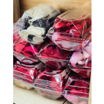 Stacked clear boxes filled with rose petals in red, pink, and white