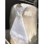 A small baby dress in a clear plastic garment bag